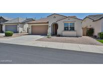 Charming single-story home with a well-maintained front yard and neutral color palette at 10739 W Sierra Pinta Dr, Peoria, AZ 85373
