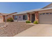 Charming single-story home with a two-car garage, low-maintenance landscaping, and inviting curb appeal at 2056 E San Tan Ct, Gilbert, AZ 85296