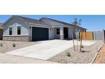 Charming single-story home with a well-manicured front yard and a two-car garage in a Gathering-friendly neighborhood at 317 S San Christo Ln, Casa Grande, AZ 85194