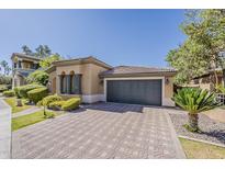 Charming single-story home with a tile roof, stone driveway and a two-car garage at 3406 E Pyrenees Pass, Phoenix, AZ 85018