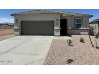 Charming single-story home with neutral stucco, concrete driveway, and well-maintained desert landscaping at 38070 W Frascati Ave, Maricopa, AZ 85138
