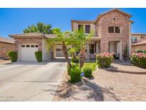 Charming two-story home featuring a brick facade, well-manicured landscaping, and a welcoming entryway at 530 S Emerson St, Chandler, AZ 85225