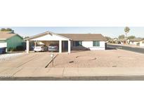 Charming single-story home featuring a carport and low-maintenance desert landscaping at 602 W Yale Dr, Tempe, AZ 85283