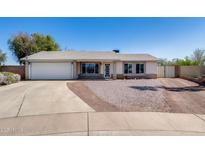 Charming single-story home with a two-car garage and low maintenance landscaping at 7210 W Caron Dr, Peoria, AZ 85345