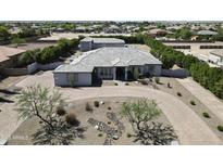 Stunning estate features circular driveway, mature landscaping, and detached garage at 16645 W Papago St, Goodyear, AZ 85338
