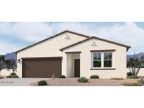 New construction home showcasing desert landscaping, a two-car garage, and a neutral color palette at 24104 W Bowker St, Buckeye, AZ 85326
