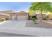 Charming single-story home with a three-car garage and desert landscaping at 26330 N 56Th Dr, Phoenix, AZ 85083