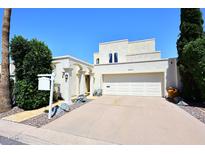 Charming stucco home featuring a two-car garage and decorative rock landscaping at 4317 N 70Th St, Scottsdale, AZ 85251