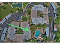 Aerial view of complex highlighting its pool and community amenities with plenty of parking at 5203 N 24Th St # 207, Phoenix, AZ 85016