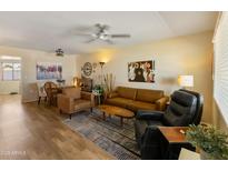 Inviting living room showcasing comfortable seating, modern decor, and bright, natural light at 13807 N Garden Court Dr, Sun City, AZ 85351