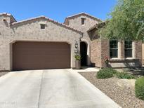 Charming home with a well-manicured landscape, neutral color palette, and tile roof at 16822 W Catalina Dr, Goodyear, AZ 85395