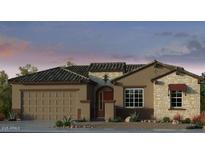 Charming single-story home with a two-car garage and stone accents around the window and doorway at 17836 W Pasadena Ave, Litchfield Park, AZ 85340