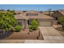 Well-maintained single-Gathering home with desert landscaping, a tile roof, and an attached two-car garage at 1904 E Grand Canyon Dr, Chandler, AZ 85249