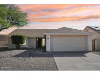 Charming single-story home with a well-maintained yard, two-car garage, and appealing curb appeal at 20149 N 92Nd Ave, Peoria, AZ 85382