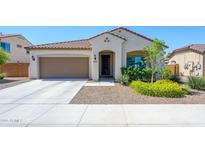 Charming single story home with a desert landscape and a two car garage at 25951 W Piute Ave, Buckeye, AZ 85396