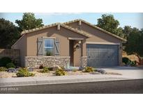 Charming single-story home featuring a stone accent wall and neutral stucco exterior with a two car garage at 311 S San Gregorio Ln, Casa Grande, AZ 85194