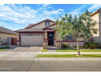 Charming one-story home with a well-manicured lawn and tasteful landscaping in a suburban neighborhood at 3890 E Perkinsville St, Gilbert, AZ 85295