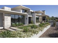 Stunning modern home showcasing meticulous landscaping and sleek architectural design elements at 4451 E Joshua Tree Ln, Paradise Valley, AZ 85253