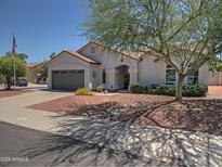Charming single-story home featuring a low-maintenance desert landscape and covered entryway at 4517 E Ute St, Phoenix, AZ 85044