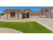 Charming home featuring a well-manicured lawn and a two-car garage, offering curb appeal and convenience at 7008 W Southgate Ave, Phoenix, AZ 85043