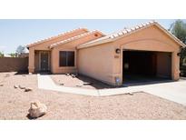 Charming single-story home with desert landscaping and an attached two car garage at 7425 N 69Th Ln, Glendale, AZ 85303