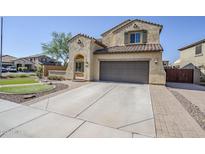 Inviting two-story home featuring a two-car garage, tile roof, and low-maintenance landscaping for enhanced curb appeal at 10925 E Toluca Ave, Mesa, AZ 85212