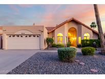 Inviting single-Gathering home features a well-manicured yard and charming desert landscaping at 11085 E Mary Katherine Dr, Scottsdale, AZ 85259