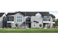 Modern townhome with a sleek gray facade, multiple windows, and a well-manicured lawn at 11300 N Casa Dega Dr # 1005, Surprise, AZ 85388