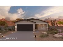 Charming single-story home featuring a two-car garage and low maintenance desert landscaping at 17065 N Lariat Rd, Maricopa, AZ 85138