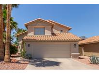 Two-story home showcasing a well-maintained front yard and an attached two-car garage at 3222 E Cortez St, Phoenix, AZ 85028