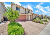 Stunning two-story home with a brick driveway and a lush, green garden in a sunny neighborhood at 3417 E Los Gatos Dr, Phoenix, AZ 85050