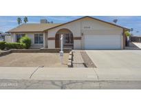 Charming single-story home showcasing a tidy front yard and inviting curb appeal at 3519 W Libby St, Glendale, AZ 85308