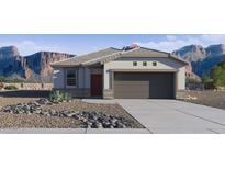 Charming single-story home with a two-car garage, desert landscaping, and stunning mountain views at 35523 N Breezy Ln, San Tan Valley, AZ 85140