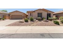 Charming single-story home featuring a well-maintained front yard with desert landscaping at 5919 W Straight Arrow Ln, Phoenix, AZ 85083