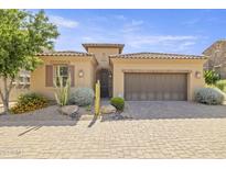 Charming single-story home with a two-car garage, desert landscaping and a beautiful tile roof at 6231 E Mark Way # 14, Cave Creek, AZ 85331