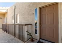 Inviting entryway with a stylish door and a well-maintained exterior at 7101 W Beardsley Rd # 542, Glendale, AZ 85308
