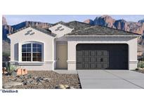 Charming single-story stucco home with a two-car garage and xeriscaped front yard against a mountain backdrop at 7370 W Buckhorn Trl, Peoria, AZ 85383