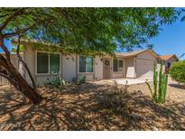 Charming single-story home with desert landscaping and a well-maintained front yard at 820 W Hononegh Dr, Phoenix, AZ 85027