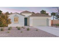Charming single-story home featuring a neutral color palette, tile roof, and a low-maintenance gravel yard at 12633 W Luxton Ln, Avondale, AZ 85323