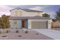 Charming two-story home with a two car garage, landscaped front yard, and covered entryway at 12647 W Parkway Ln, Avondale, AZ 85323