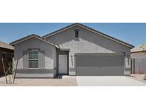 Charming single-story home with a two-car garage and neutral-colored stucco finish at 15507 W Deanne Dr, Waddell, AZ 85355