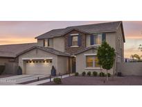 Charming two-story home featuring a two-car garage, landscaped yard, and inviting front entrance at 2854 E Virginia St, Mesa, AZ 85213
