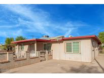 A charming single-story home featuring a fenced front yard, covered porch, and freshly painted exterior at 3622 W Sunland Ave, Phoenix, AZ 85041
