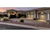 Stunning home exterior featuring a manicured landscape, a tiled roof, and a two-car garage at 402 E Windmere Dr, Phoenix, AZ 85048