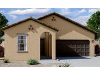 Charming single-story home with a neutral-toned exterior, arched entryway, and a two-car garage at 6029 E Artemis Dr, Florence, AZ 85132