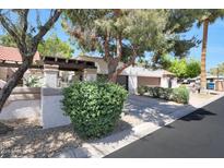 Charming home featuring a two-car garage and manicured landscaping at 7368 E Pleasant Run, Scottsdale, AZ 85258