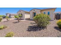 Charming home with well-maintained gravel landscaping and mature shrubbery at 9345 W Robin Ln, Peoria, AZ 85383