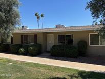 Charming single-story home with well-maintained landscaping and covered entry at 13603 N 111Th Ave, Sun City, AZ 85351