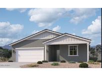 Charming single-story home with a two-car garage, neutral color palette, and nicely landscaped front yard at 24096 W Bowker St, Buckeye, AZ 85326