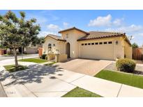Charming single-story home with a well-manicured front yard, tiled roof and a two car garage at 3634 E Perkinsville St, Gilbert, AZ 85295